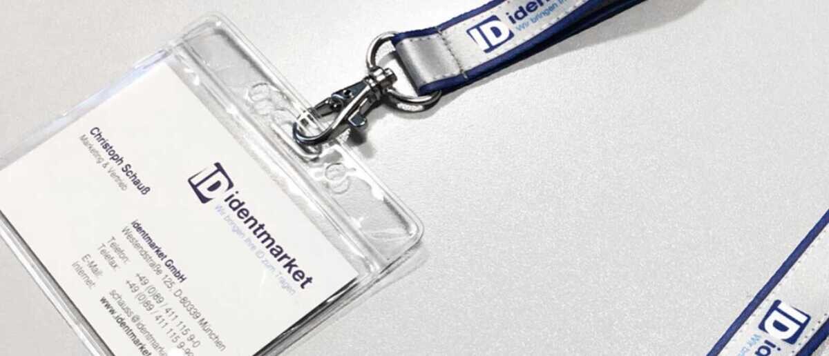 Employee wearing a custom company lanyard with ID badge holder